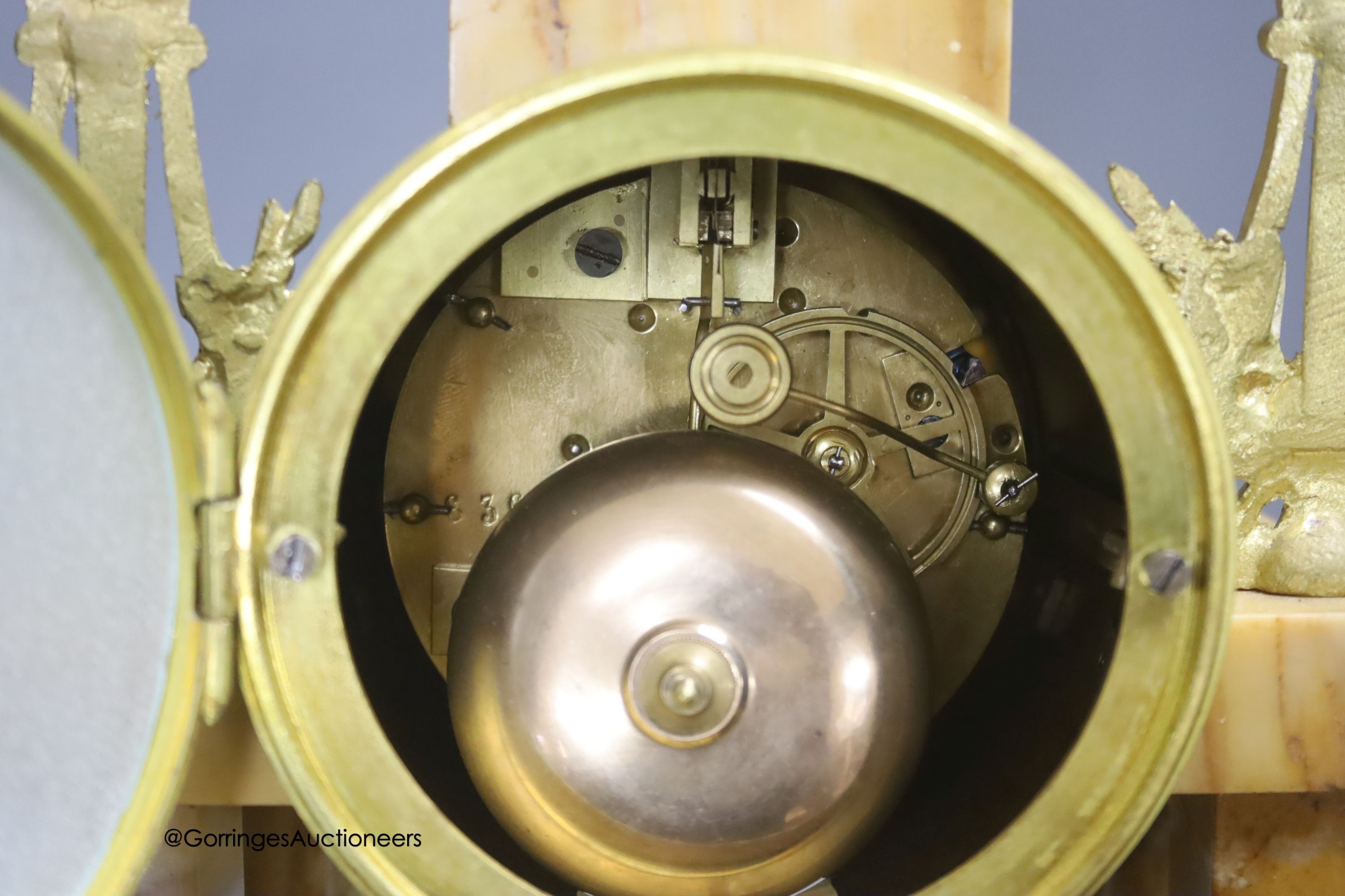 A 19th century French marble and gilt metal mantel clock, with key and pendulum, height 42.5cm